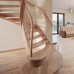 Spiralne schody z jasnego drewna z balustradą, widoczne z dołu, z zaokrągloną podstawą i drewnianą podłogą w tle.