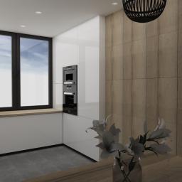 Blanka Mróz - Wizualizacja nowoczesnej kuchni z białymi, lakierowanymi szafkami, drewnianym blatem i okładziną ścienną w kolorze drewna, z czarnym piekarnikiem i płytą indukcyjną oraz dużym oknem z widokiem...