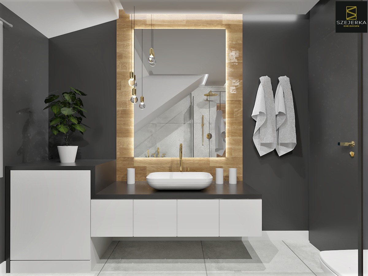 Nowoczesna łazienka w odcieniach szarości z białymi akcentami, podświetlanym lustrem w drewnianej ramie, wiszącymi lampami, umywalką nablatową i rośliną doniczkową.