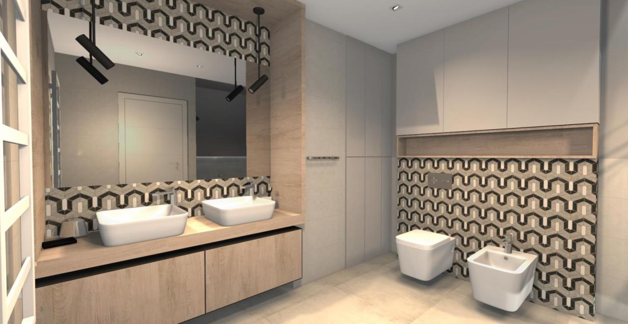 Wizualizacja łazienki z dwoma umywalkami nablatowymi, toaletą i bidetem, wykończona płytkami w geometryczny wzór i drewnopodobnymi szafkami pod umywalkami.