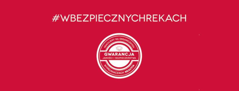 Czerwone tło z białym logo 'Gwarancja jakości i bezpieczeństwa' dla wypełniaczy Neauvia i hasłem #WBEZPIECZNYCHREKACH.