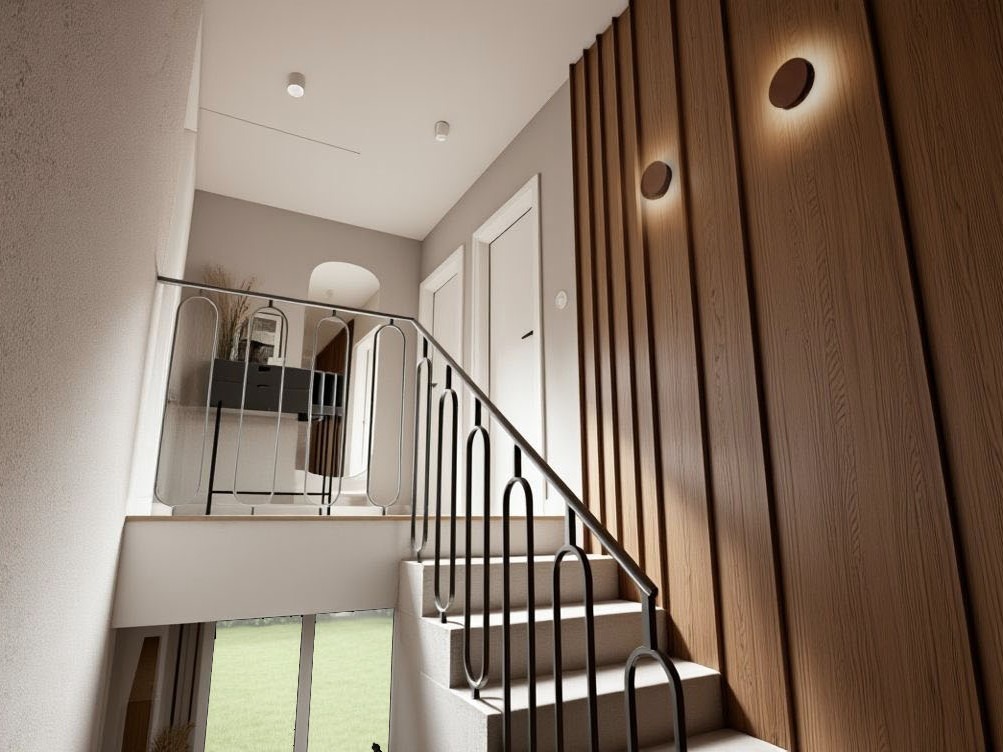 Nowoczesne schody z czarną balustradą i drewnianą ścianą z oświetleniem punktowym. Widok z dołu na jasne wnętrze z elementami dekoracyjnymi.