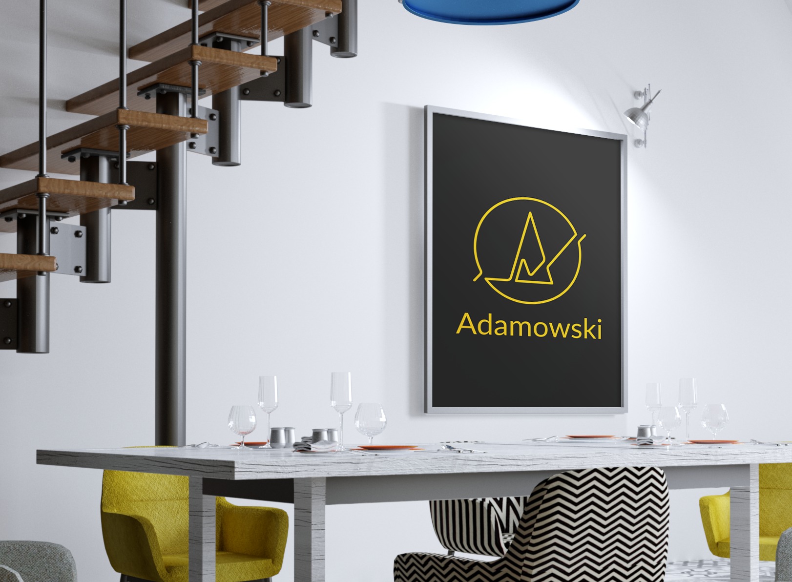Grafika z logo Adamowski w czarnej ramie nad stołem z zastawą, w tle schody.