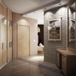 Haverim Galyna Obushok - Nowoczesny przedpokój z przesuwną szafą, szarą płytką podłogową, ceglaną ścianą z obrazem w ramie i drewnianą komodą z lustrem.