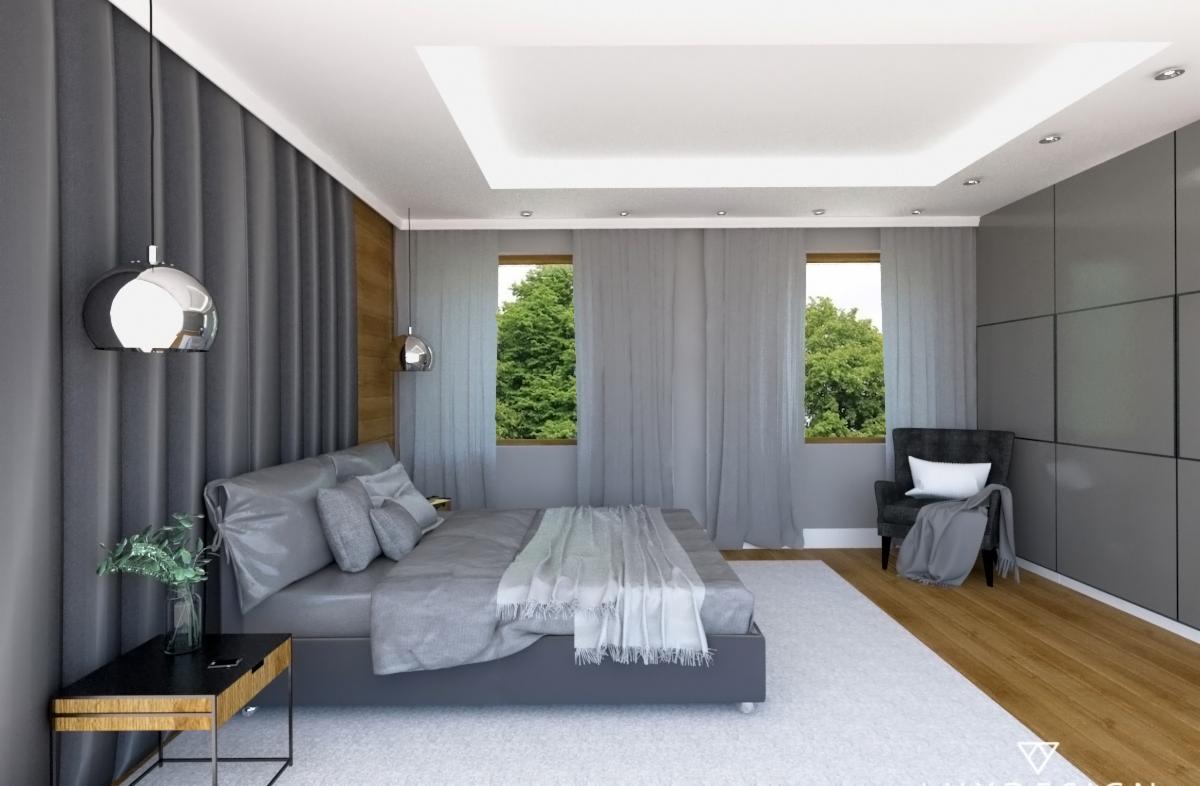 Nowoczesna sypialnia w odcieniach szarości z dekoracyjną ścianą z paneli, wiszącymi lampami kulistymi i widokiem na zieleń za oknem.