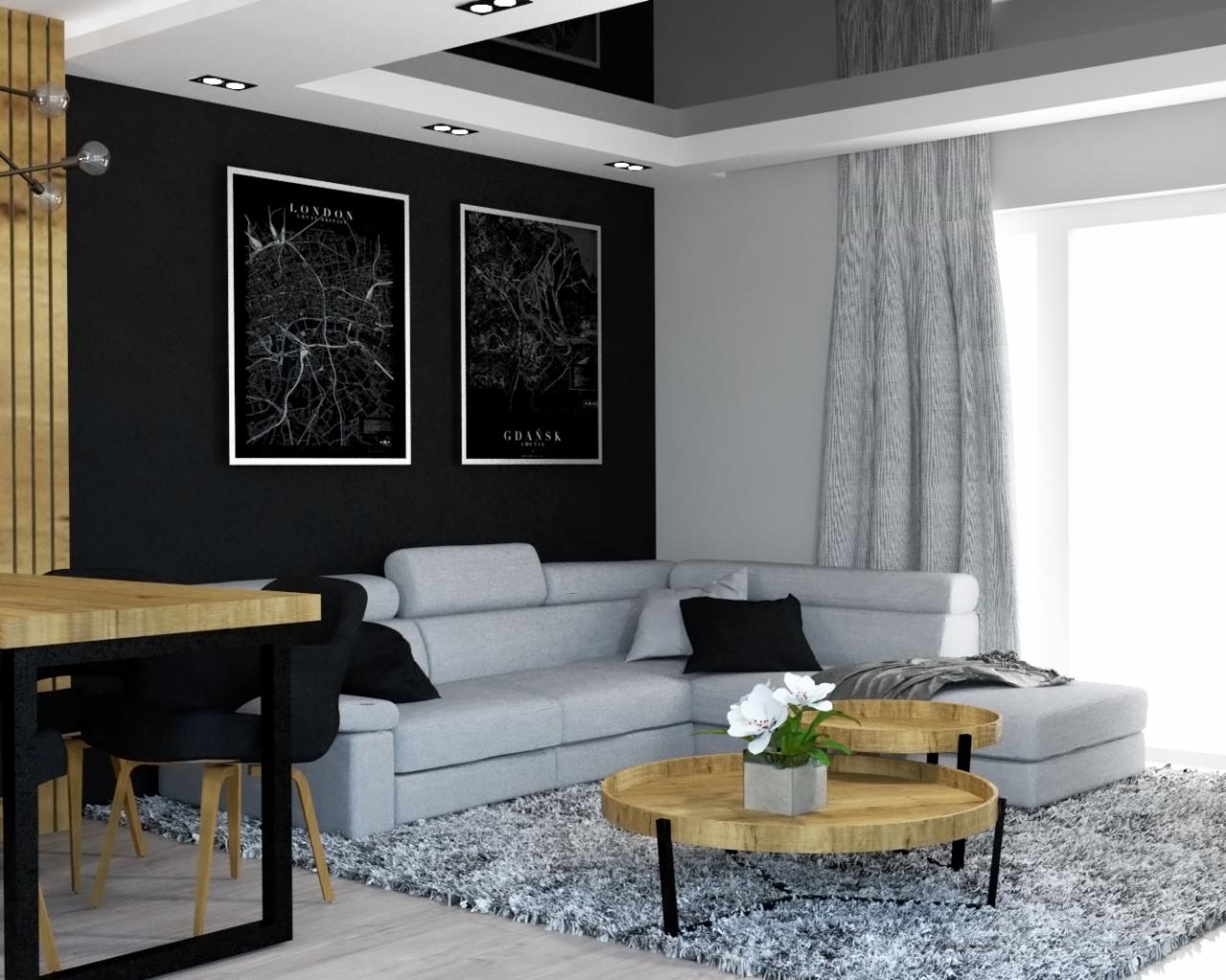 Nowoczesny salon z szarą sofą narożną, drewnianym stołem i czarnymi krzesłami, ozdobiony plakatami z mapami Londynu i Gdańska na czarnej ścianie.