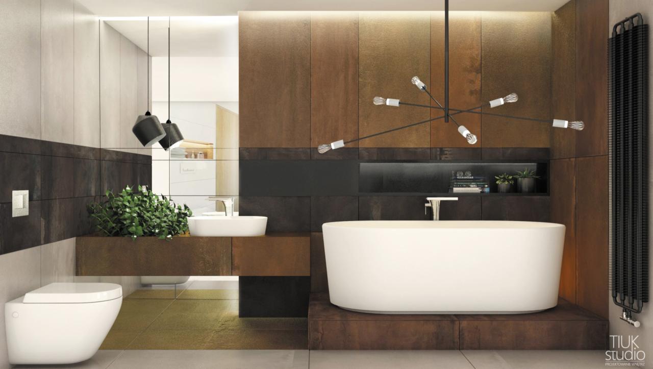 Nowoczesna łazienka z wanną wolnostojącą, umywalką nablatową, toaletą wiszącą i brązowo-czarnymi płytkami imitującymi rdzę, oświetlona lampą z żarówkami Edison