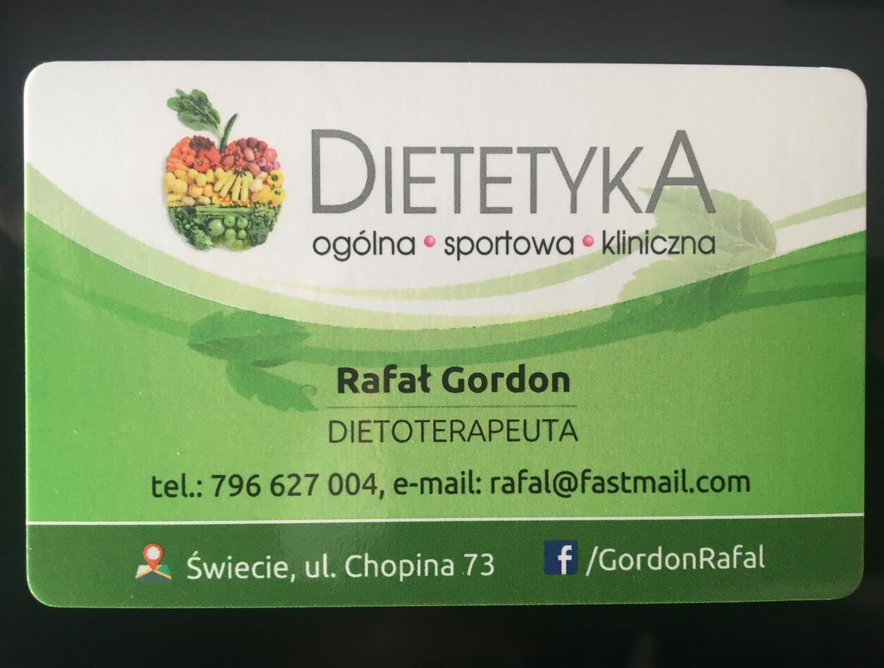 Wizytówka z nazwą firmy Dietetyka, imieniem Rafał Gordon, opisem dietoterapeuta, numerem telefonu, adresem e-mail, adresem stacjonarnym i ikoną jabłka ułożonego z warzyw i owoców.