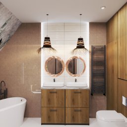 Dekorroom - Wizualizacja łazienki z wanną, umywalką z szafką z drewnianymi frontami, dwoma okrągłymi lustrami i lampami w stylu boho. Brązowe płytki na ścianach.