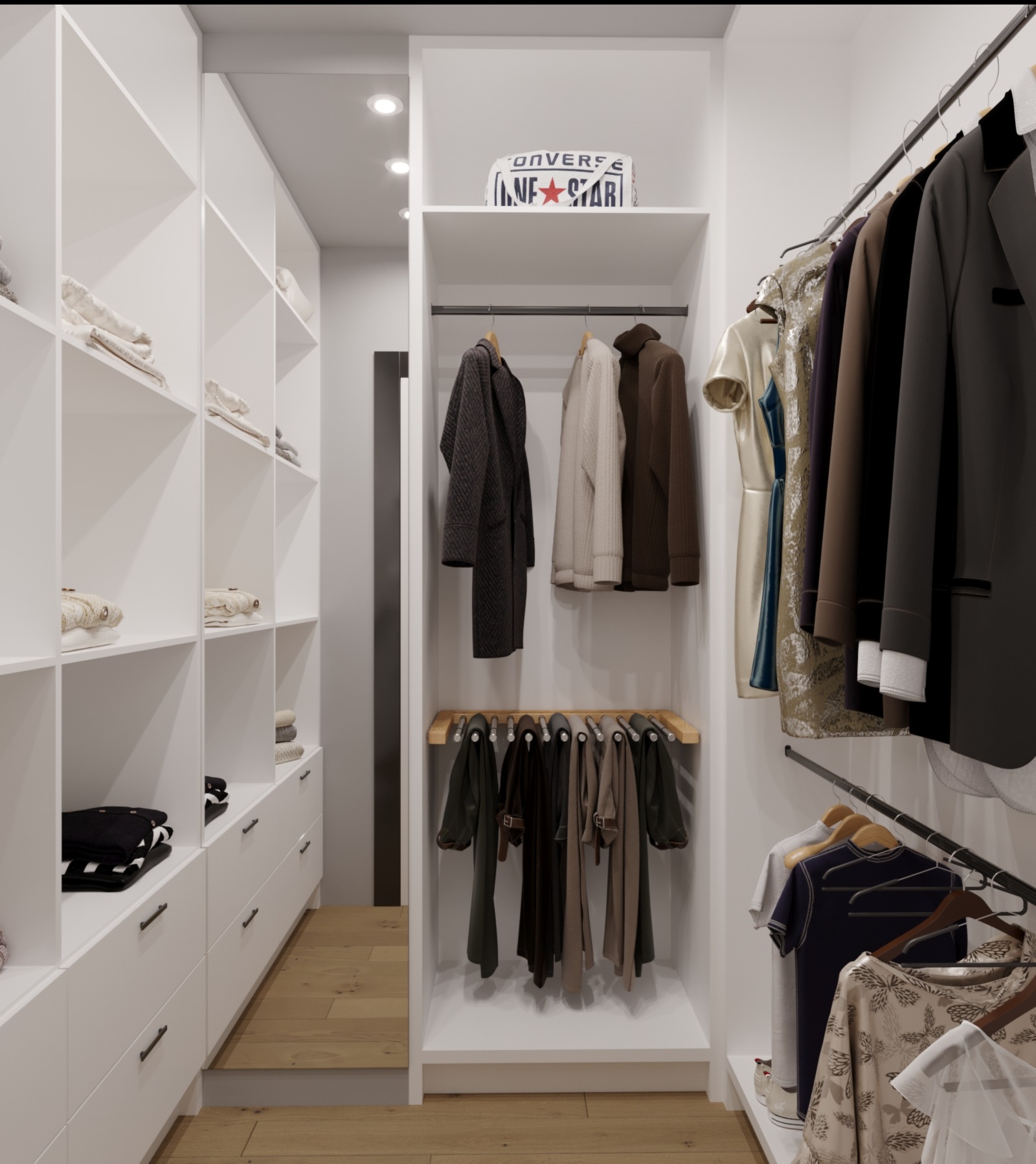Widok na wnętrze garderoby z białymi półkami i szufladami, ubraniami wiszącymi na wieszakach i półce oraz drewnianą podłogą.