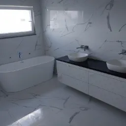 Nowoczesna łazienka z białymi płytkami imitującymi marmur, wolnostojącą wanną i umywalką nablatową na szafce z czarnym blatem, widoczne folie ochronne na meblach.