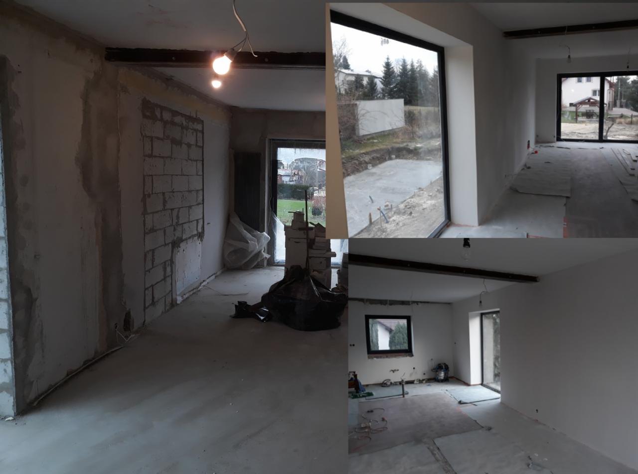 Wnętrze domu w trakcie remontu: surowe ściany z fragmentami cegieł, częściowo pokryte szpachlą, widoczne okna z czarnymi ramami, podłoga przygotowana do dalszych prac wykończeniowych, widoczne...
