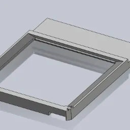 CAD model of a rectangular frame with a raised section, showing detailed edges and screw holes, rendered on a plain background.