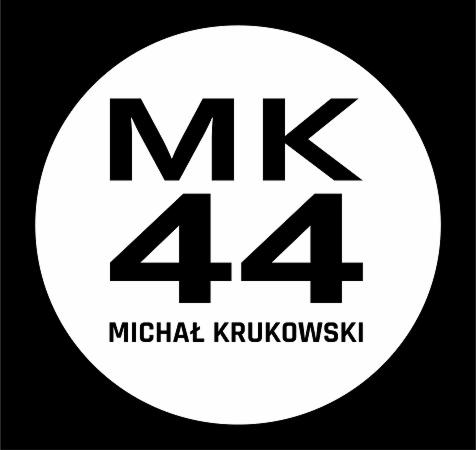 Logo firmy MK 44 Michał Krukowski na białym tle w czarnej obwódce.