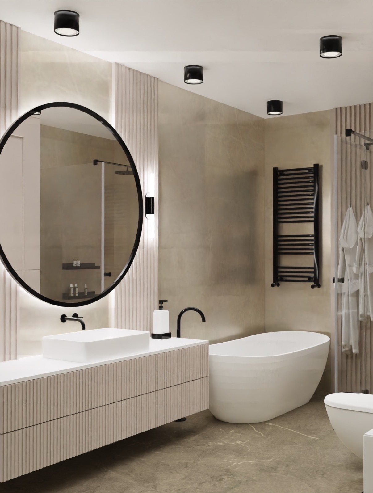 Nowoczesna aranżacja łazienki w Warszawie z owalnym lustrem z podświetleniem LED, białą umywalką nablatową, wolnostojącą wanną i grzejnikiem drabinkowym w czarnym kolorze.