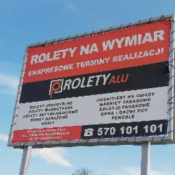Billboard reklamowy firmy RoletyALU z ofertą na wymiar, ekspresowe terminy realizacji, obejmującą między innymi rolety zewnętrzne, wewnętrzne i antywłamaniowe, bramy garażowe, kraty, moskitiery...