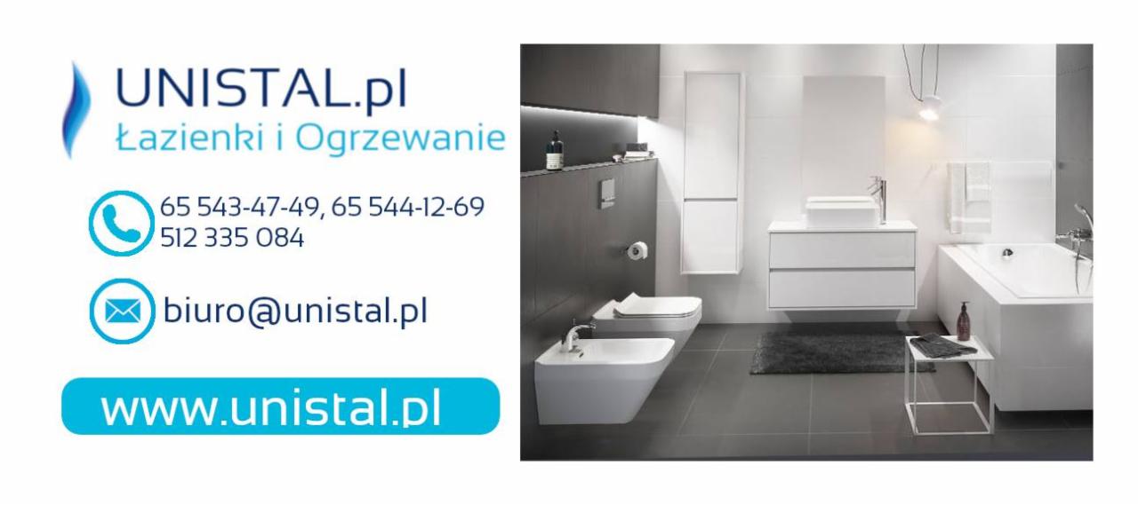 Nowoczesna aranżacja łazienki z białymi elementami: toaleta, bidet, umywalka z szafką, wanna, szara podłoga i ciemna ściana z oświetleniem punktowym, po lewej stronie logo firmy UNISTAL.pl.