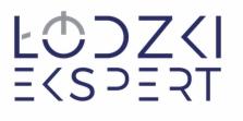Logo firmy 'Łódzki Ekspert' w kolorze granatowym i szarym na białym tle, stylizowane litery.