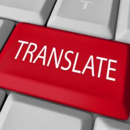 Czerwony klawisz z napisem TRANSLATE na białej klawiaturze, render 3D.