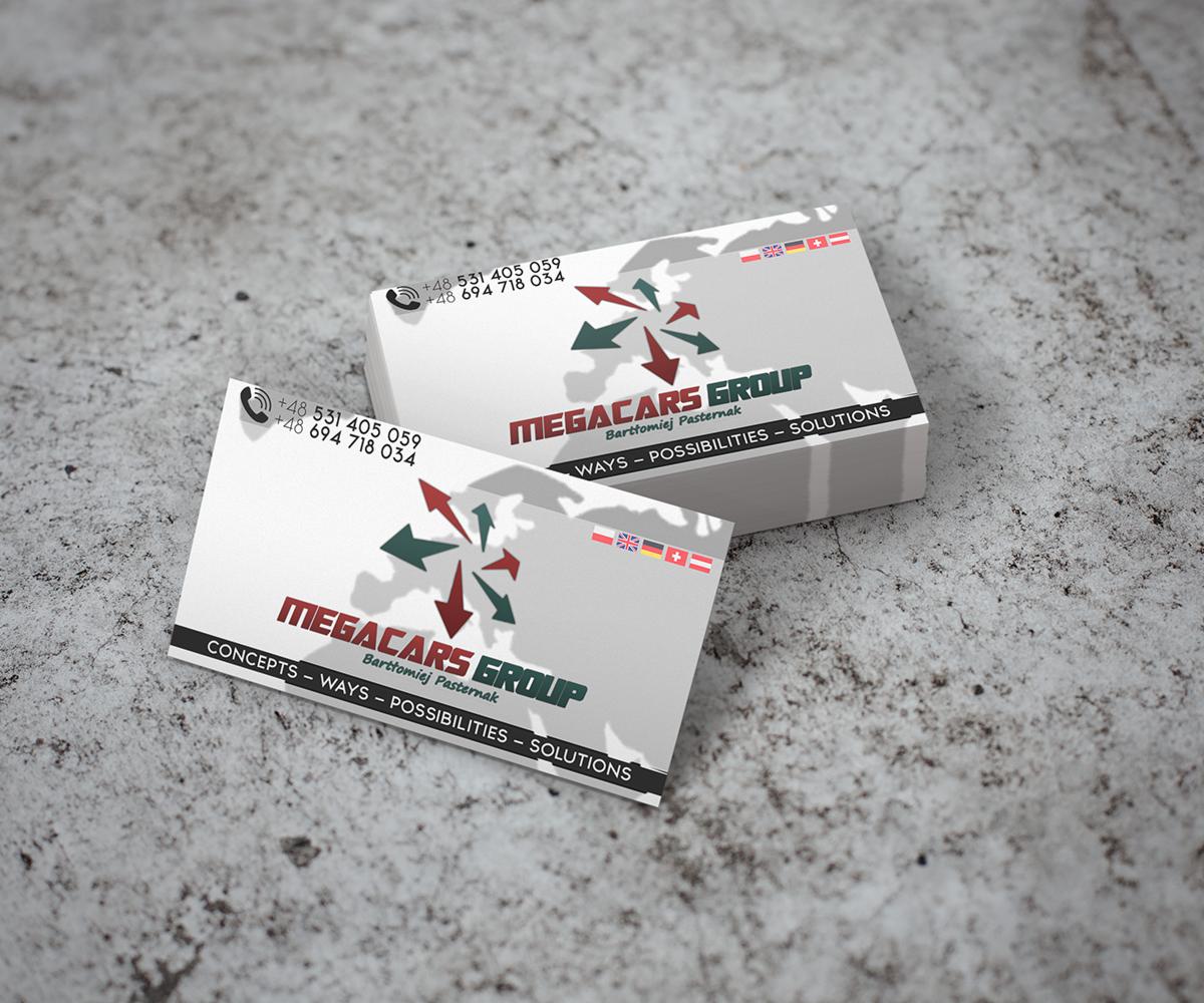 Dwie wizytówki firmy Megacars Group leżące na szarym, teksturowanym tle, prezentujące logo z zielonymi i czerwonymi strzałkami oraz hasło 'WAYS - POSSIBILITIES - SOLUTIONS'.