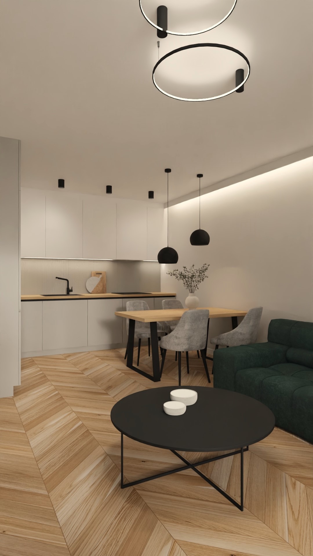 Nowoczesne wnętrze: parkiet w jodełkę, minimalistyczna kuchnia z drewnianym blatem, okrągły stolik kawowy i lampy w kształcie pierścieni. Stonowana kolorystyka.