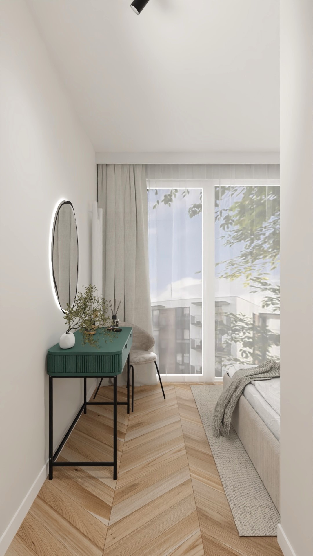 Sypialnia z toaletką w odcieniach bieli i zieleni. Na blacie wazonik z kwiatami i okrągłe lustro z podświetleniem LED. Parkiet ułożony w jodełkę.