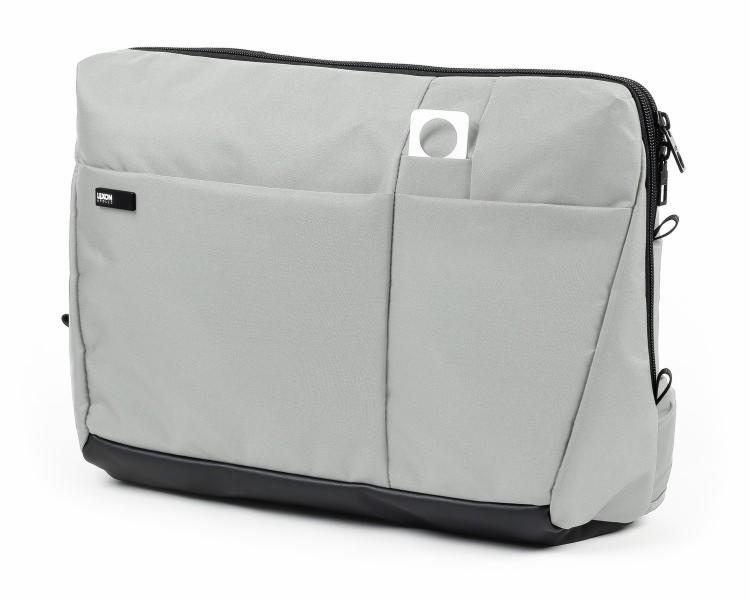 Szara torba na laptopa z czarnym zamkiem błyskawicznym i dolną częścią, widoczna kieszeń z małym kwadratowym uchwytem.