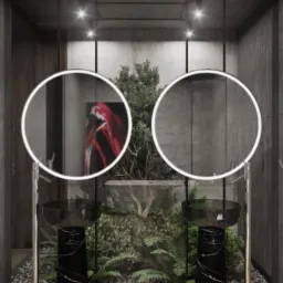 Nowoczesna łazienka z dwoma okrągłymi lustrami z podświetleniem LED, czarnymi umywalkami na marmurowych postumentach, roślinami w tle i betonowymi ścianami.