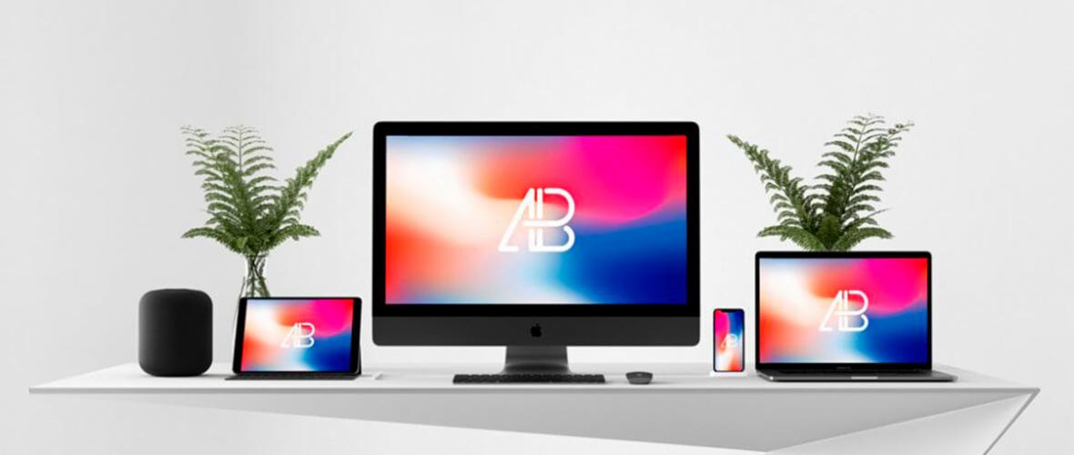 Mockup przedstawiający responsywny design strony internetowej na komputerze, laptopie, tablecie i telefonie komórkowym, z roślinami w tle.