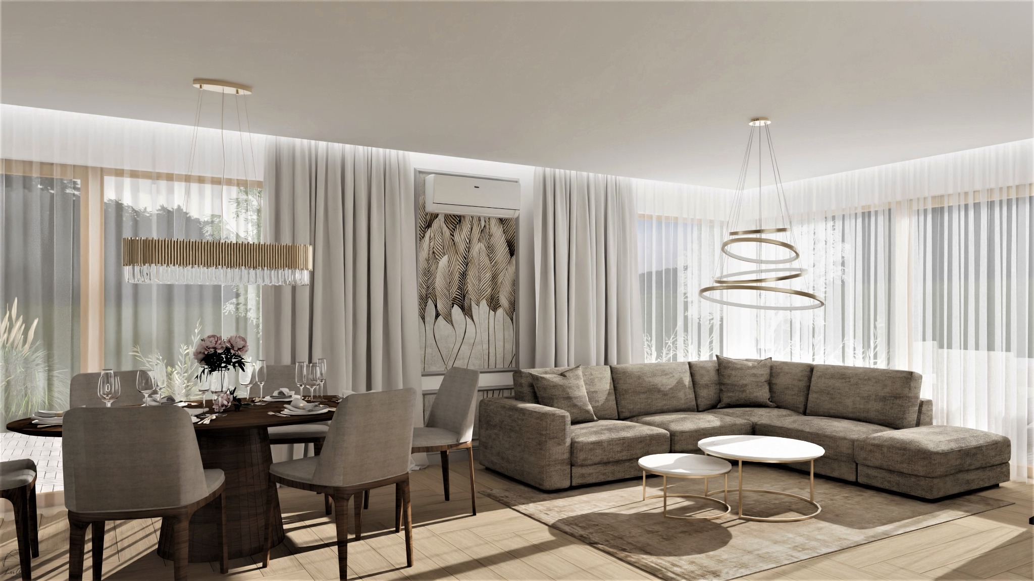 Jasne wnętrze z dużym narożnikiem, okrągłym stołem jadalnym z nakryciem i kwiatami, oraz nowoczesnymi lampami wiszącymi i obrazem z motywem liści na ścianie.
