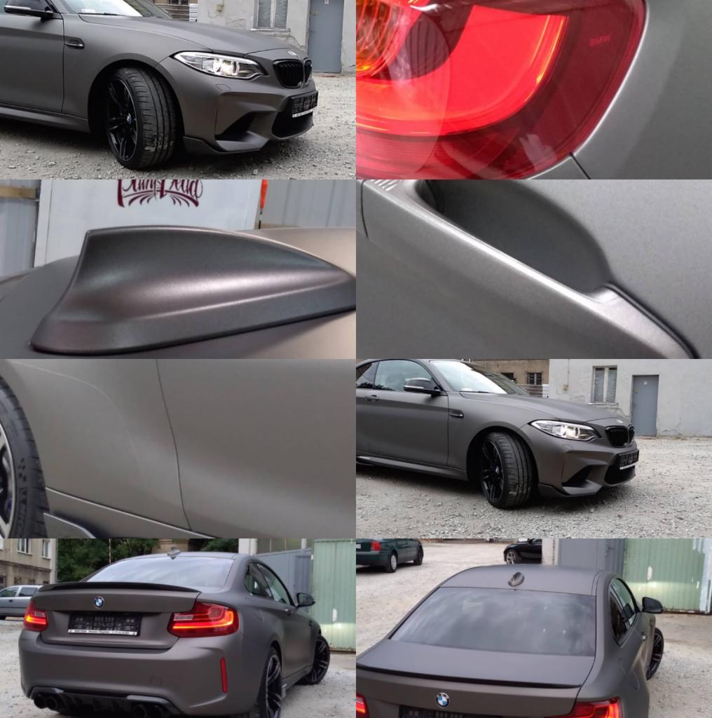 Matowy, szary BMW M2 z czarnymi felgami, prezentowany z różnych perspektyw, w tym zbliżenie na tylne światło, antenę rekina i klamkę, na tle miejskiej zabudowy.