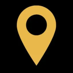 Złota ikona lokalizacji na czarnym tle, symbolizująca usługi geodezyjne.