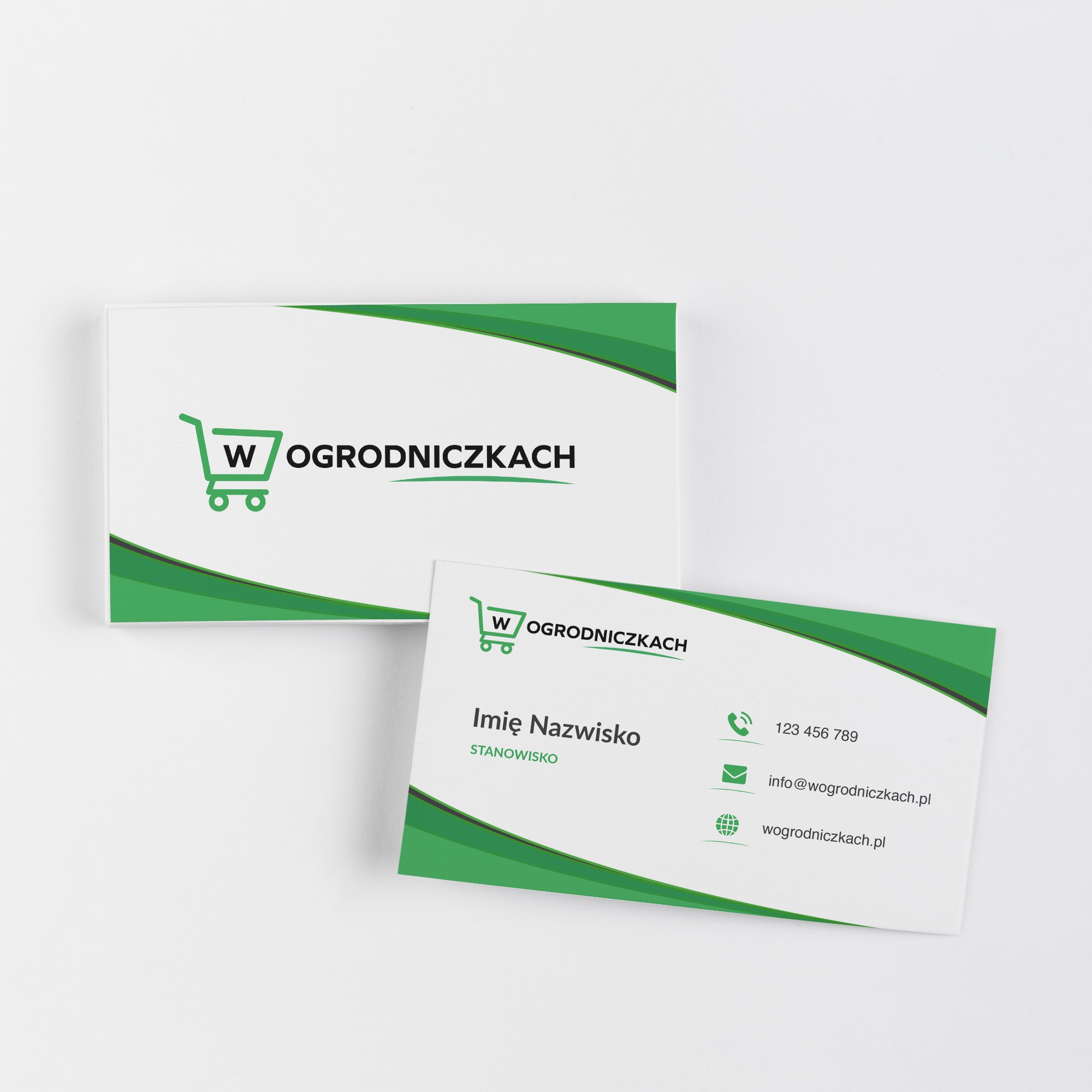 Dwie wizytówki firmy z Lublina z zielonym motywem graficznym i logotypem przedstawiającym wózek sklepowy z literą W.