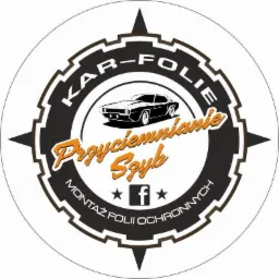 Logo firmy z Lubania oferującej montaż folii ochronnych i przyciemnianie szyb, z sylwetką samochodu i napisem 'Przyciemnianie Szyb'.