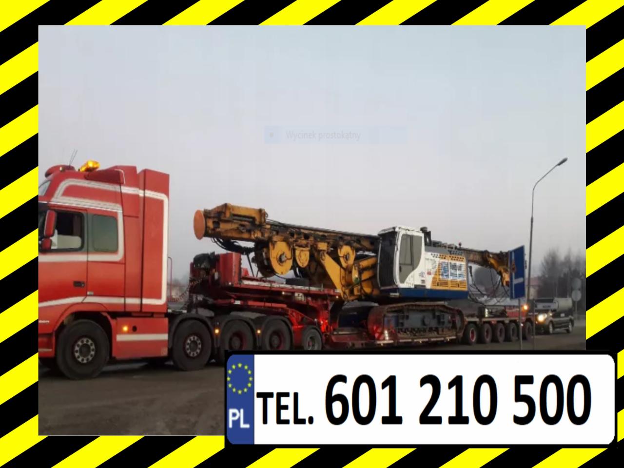 Czerwona ciężarówka z naczepą przewożąca dużą, żółto-białą maszynę budowlaną na gąsienicach, widoczny numer telefonu.