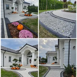 Elegancki podjazd i ścieżki wokół białego domu z kolumnami, wykończone jasnym kruszywem z ciemnoszarą obwódką, dekorowane dyniami i chryzantemami, sugerujące jesienną aranżację.