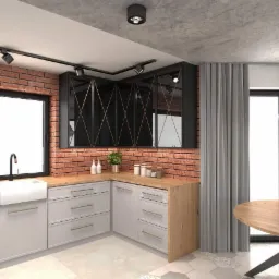 Nowoczesna kuchnia z ceglaną ścianą, szarymi szafkami, drewnianym blatem i czarnymi szafkami wiszącymi z geometrycznym wzorem na szkle.