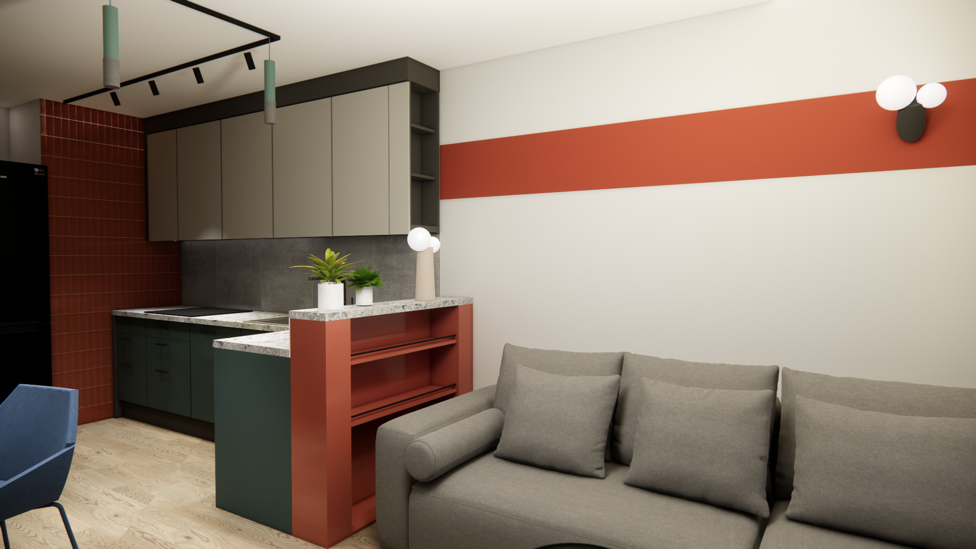 Nowoczesne wnętrze: kuchnia z zielonymi szafkami i ceglaną ścianą, połączona z salonem z szarą sofą. Akcent stanowi pomarańczowy pas na ścianie i regał.