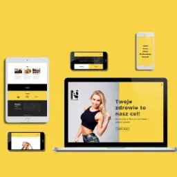 Prezentacja responsywnej strony internetowej na laptopie, tablecie i smartfonach na żółtym tle. Motywacją jest zdrowie i sylwetka.