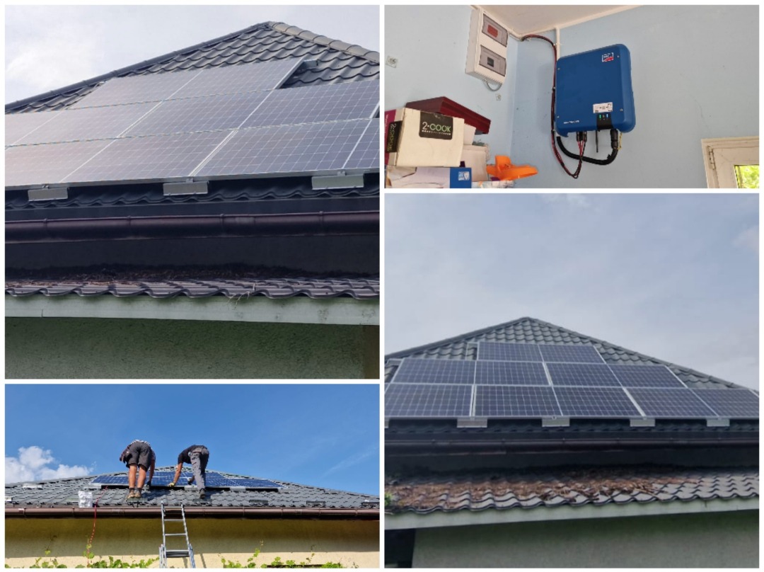 Montaż paneli fotowoltaicznych na dachu domu z wykorzystaniem drabiny, widoczny falownik na ścianie wewnątrz budynku oraz instalacja elektryczna.