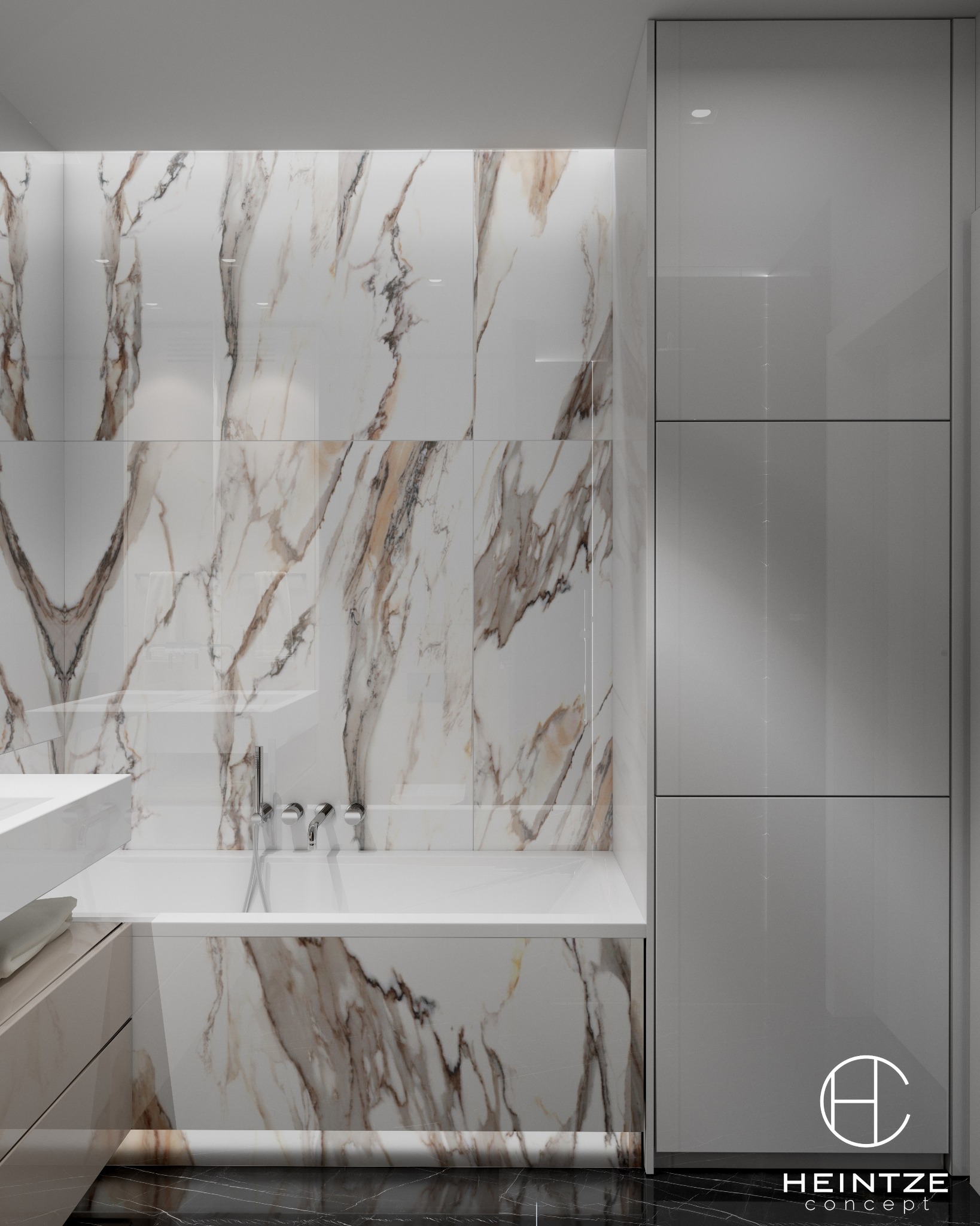 Nowoczesna łazienka z wanną obudowaną marmurowymi płytami, armatura w kolorze chromu, biała umywalka i szafka oraz wysoka, szara szafka z połyskiem.