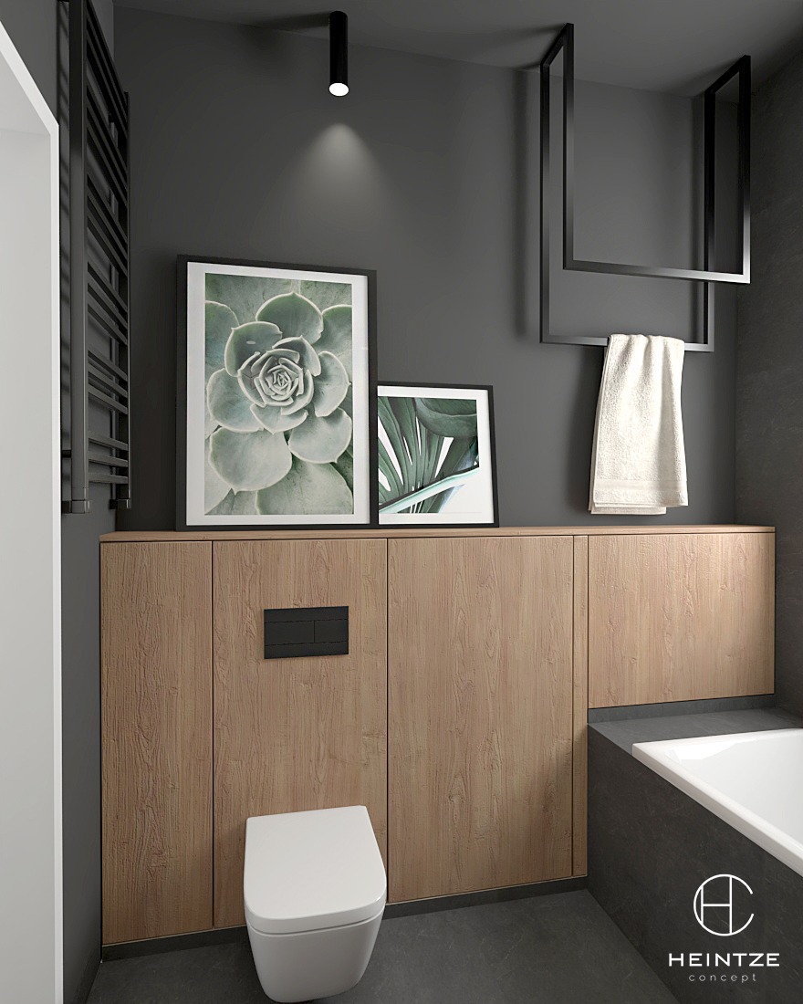 Nowoczesna łazienka w Zielonej Górze z szarą ścianą, drewnianymi szafkami pod umywalką, wiszącą toaletą, czarnym grzejnikiem drabinkowym, dekoracyjnymi obrazami w ramkach i minimalistycznym...