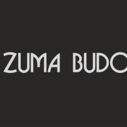 Logo firmy ZUMA BUDOWY z symbolem diamentu po lewej stronie, na ciemnoszarym tle.