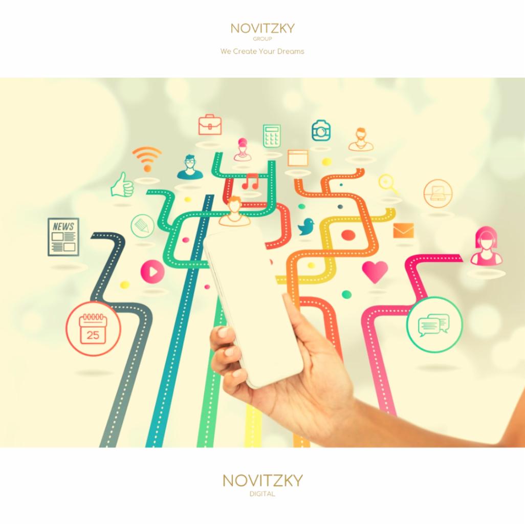 Dłoń trzymająca smartfon na tle abstrakcyjnej grafiki przedstawiającej kolorowe ścieżki z ikonami symbolizującymi różne aspekty komunikacji i mediów społecznościowych, takie jak poczta, kalendarz...