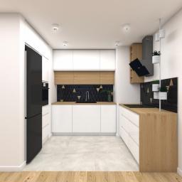 Moma Design Magdalena Moraczyńska - Wizualizacja nowoczesnej kuchni z białymi szafkami, drewnianymi blatami i czarną mozaiką z geometrycznym wzorem nad blatem, uzupełniona czarną lodówką i pionowym kwietnikiem.