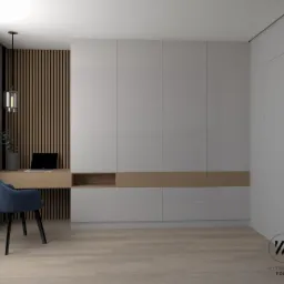 Nowoczesny pokój z szarą zabudową meblową, biurkiem z drewnianym blatem i niebieskim krzesłem na tle ściany z drewnianych paneli.