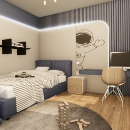 AUMÜLLERDESIGN Pracownia Rozwoju Przestrzeni - Pokój dziecięcy w stylu nowoczesnym: łóżko z niebieską ramą, biurko z komputerem, zabawki i dekoracja ścienna z motywem astronauty.