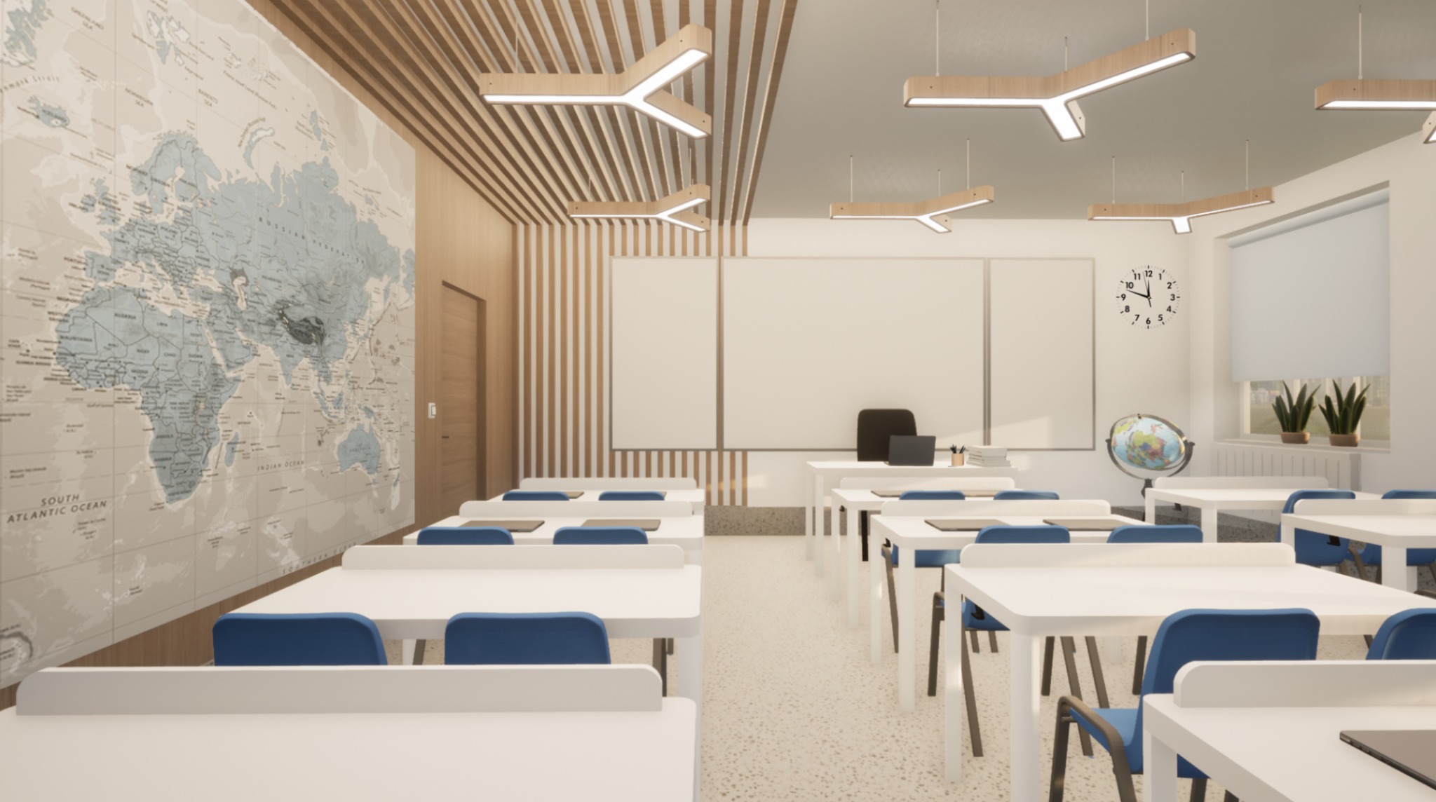 Nowoczesna klasa z mapą świata na ścianie, białymi ławkami i niebieskimi krzesłami. Oryginalne oświetlenie sufitowe. Czyste, jasne wnętrze.