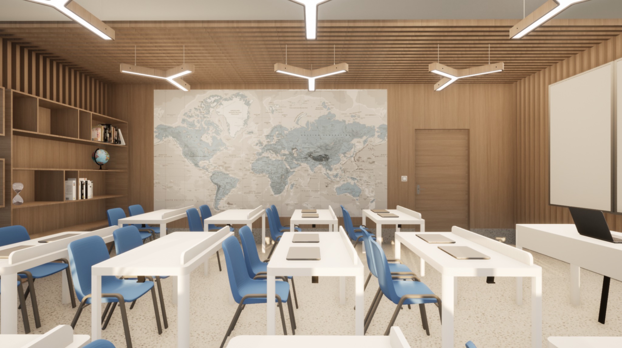 Jasna klasa z drewnianymi panelami, mapą świata i białymi ławkami z niebieskimi krzesłami. Nowoczesne oświetlenie sufitowe w kształcie litery Y.