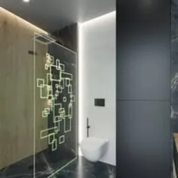 Nowoczesna łazienka z kabiną prysznicową z geometrycznym wzorem, podwieszaną toaletą i czarnymi elementami wykończenia.